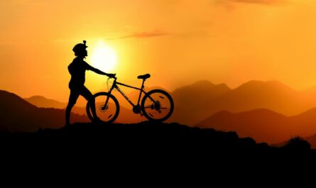 Silhouette Photography of Biker on Top of Hill